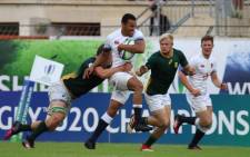 England's Jordan Olowofela shrugs off his South African opponents during their World Rugby Under-20 Championship match on 12 June 2018. Picture: @WorldRugby/Twitter