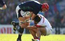 United States' Phil Thiel has his hands full trying to pull down Grant Gilchrist. Picture: Rugbyworld.com