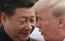 FILE: China's President Xi Jinping (L) and US President Donald Trump attend a welcome ceremony at the Great Hall of the People in Beijing on 9 November 2017. Picture: AFP
