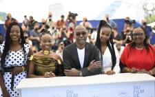 (From L) Chadian actress Briya Gomdigue, Chadian actress Achouackh Abakar Souleymane, Chadian director Mahamat-Saleh Haroun, Chadian actress Rihane Khalil Alio and Chadian actress Hadje Fatime Ngoua pose during a photocall for the film "Lingui" (The Sacred Bonds) at the 74th edition of the Cannes Film Festival in Cannes, southern France, on July 9, 2021. Picture: Christophe Simon / AFP.