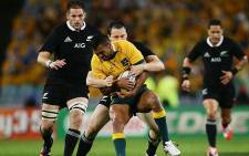 Ben Smith takes down Kurtley Beale while skipper Richie McCaw prepares to join ruck in Sydney on 16 August 2014. Picture: Facebook.