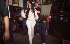 US reality television star Kim Kardashian waves her hand as she walks with her son Saint in Yerevan on 7 October 2019. The US reality television star Kim Kardashian baptised her children during a visit to her ancestral homeland Armenia. Picture: AFP