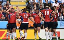 FILE: Namibia's players celebrate after scoring a try at the end of a Pool C match of the 2015 Rugby World Cup between Argentina and Namibia at Leicester City Stadium in Leicester, central England, on 11 October, 2015. Picture: AFP
