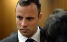 Oscar Pistorius before the start of proceedings on 24 March 2014 at the High Court in Pretoria. Picture: Pool.