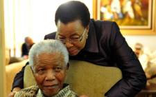 Former president Nelson Mandela with his wife Graca Machel at his Houghton home in Johannesburg. Picture: GCIS/SAPA.