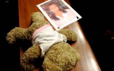 A picture of Kirsty Theologo next to a teddy bear in the Palm Ridge Magistrate’s Court on 7 November 2013. Picture: Vumani Mkhize.