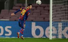 Barcelona's Argentinian forward Lionel Messi jumps for the ball during the Spanish league football match between FC Barcelona and Levante UD at the Camp Nou stadium in Barcelona on December 13, 2020. Picture: AFP