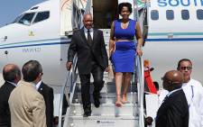President Jacob Zuma steps off the plane with his wife as he arrives for he G20 Summit in Los Cabos, Mexico on 17 June 2012.. Picture: GCIS
