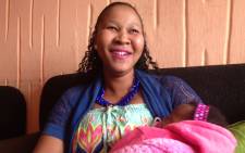 Lindiwe Ndwandwe a survivor of the TB Joshua church building collapse and her one month-old baby Minenhle. Picture: Vumani Mkhize/EWN.