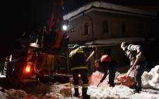Rescuers remove snow on a road to the village of Penne, after an avalanche engulfed a mountain hotel in earthquake-ravaged central Italy, on January 19, 2017. Picture: AFP 