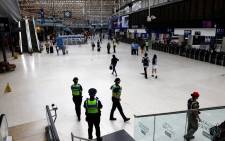 Police officers patrol at Waterloo Station in London on August 18, 2022 as Britain's train network faced further heavy disruption in major walkouts that follow the sector's biggest strike action for 30 years already this summer. Picture: Carlos Jasso/AFP