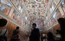 Visitors view the Sistine Chapel at the Vatican Museums (Musei Vaticani) which reopen to the public on 1 June 2020 in The Vatican, while the city-state eases its lockdown aimed at curbing the spread of the COVID-19 infection, caused by the novel coronavirus. Picture: AFP.
