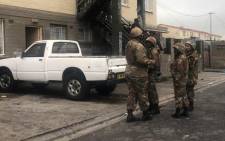 SANDF troops support a police raid in Manenberg on 18 July 2019. Kaylynn Palm/EWN