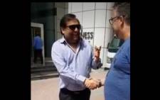 A screengrab from a video of South African businessman Justin Van Pletzen with Ajay Gupta in Dubai