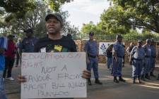 Police guard the Hoërskool Overvaal  in Vereeniging where EFF members are protesting the school's admission policy on 17 January 2018. Picture: Ihsaan Haffejee/EWN