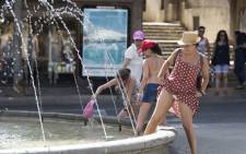 Women cool off in water fountains at Parc de Sa Riera in Palma de Mallorca, on 26 June 2019 at the start of a heatwave tipped to break records across Europe. Picture: AFP