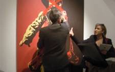 'The Spear' being defaced as eNews anchor Iman Rappetti looks on. Picture: Gareth Brown/iWitness