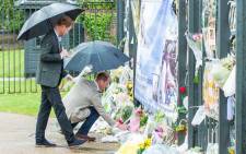 Prince Harry and Prince William lay flowers at the White Garden at the gates of Kensington Palace. Picture: Facebook.com.