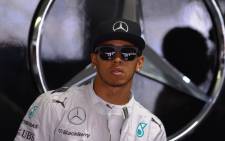 FILE: Hamilton took pole position which championship-leading Mercedes team mate Nico Rosberg qualifying alongside him on the front row. Picture: AFP.