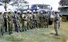 United Nations peacekeepers from Mali are briefed before their patrol during elections in Bangui in the Central African Republic in 1998. Picture: UN Photo