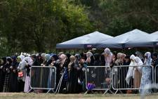 Mourners offer funeral prayers for Khalid Mustafa and his son Hamza Mustafa, slain by an Australian white supremacist gunman who shot down 50 Muslims at two mosques, at the Memorial Park cemetery in Christchurch on 20 March 2019. Picture: AFP