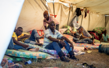 Young Malawian men sit inside their tent in the Isipingo camp on 25 April 2015, which was a temporary home for people displaced by xenophobic violence in Durban. Picture: Aletta Gardner/EWN