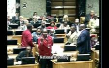 FILE: EFF Chief Whip Floyd Shivambu showing deputy president Cyril Ramaphosa middle finger in Parliament on 17 September 2014. Picture: Twitter - @Gareth EdwardsSA.