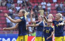 Sweden's players celebrate at the end of the France 2019 Women's World Cup quarter-final football match between Germany and Sweden, on 29 June, 2019, at the Roazhon park stadium in Rennes, north western France. Picture: AFP.