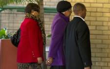 Winnie Madikizela-Mandela (C) arrives on June 10, 2013 with her daughter Zindzi (L) at a Pretoria hospital where her ex-husband, former South African President Nelson Mandela has been hospitalized as a result of recurring lung infection. Mandela remains in a serious but stable condition as he receives intensive care for a recurrent lung infection, the South African government said on June 10. Picture: AFP.