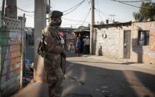 An SANDF soldier on patrol in Alexandra on 13 July 2021 following days of rioting and looting in the township. Picture: Boikhutso Ntsoko/Eyewitness News