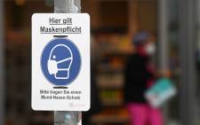 A mask compulsory sign has been put up in the Bavarian city of Rosenheim, southern Germany, on 1 April 2021, amid the ongoing coronavirus pandemic. Picture: AFP