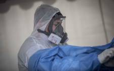 A healthcare worker removing PPE at the Nasrec Field Hospital in Johannesburg. Picture: Abigail Javier/Eyewitness News