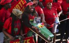 An EFF supporter carries a coffin depicting President Jacob Zuma. Picture: Cindy Archillies/EWN