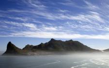 A general view of the Hout Bay harbour covered in mist from the Chapman’s peak road on the outskirts of Cape Town. Picture: AFP.