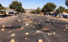 Protesters put rocks and tyres to block major roads in Orlando West, Soweto to vent their frustration about Eskom pre-paid electricity meter. Picture: @nkosi_milton.