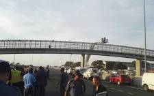 Officials pictured on scene at the footbridge at Borcherds Quarry near Cape Town International Airport, where a man threatened to commit suicide on 19 January 2018. Picture: Supplied. 