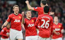 Manchester United player celebrate after winning their 20th English Premier League title on 22 April 2013. Picture: AFP