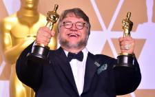'The Shape of Water' director Guillermo del Toro with his Oscar awards on 4 March 2018. Picture: AFP