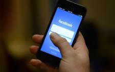 FILE: The Facebook app on a smartphone. Picture: AFP