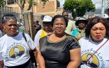 Nyameka Mabandla (center), the wife of slain activist Loyiso Nkohla, with supporters outside the Athlone Magistrates court on 1 December 2023. Picture: Carlo Petersen/Eyewitness News