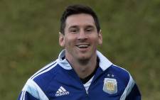 FILE: Argentina’s forward Lionel Messi jogs during a training session at Cidade do Galo. Picture: AFP.
