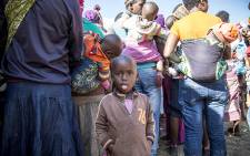 FILE: A little girl waits for her mother to receive supplies at a camp for displaced foreign nationals in Primrose on 18 April 2015. Picture: Thomas Holder/EWN.
