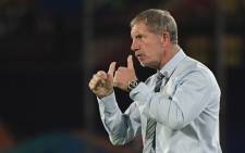FILE: South Africa's coach Stuart Baxter encourages his players during the 2019 Africa Cup of Nations (CAN) Group D football match between South Africa and Namibia at the Al Salam Stadium in the Egyptian capital Cairo on 28 June 2019. Picture: AFP