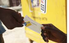 A vendor sells MTN airtime at an MTN office in Abuja, Nigeria. Picture: EPA/Tony Nwosu