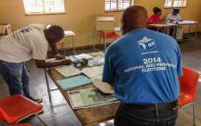 IEC officials prepare to receive people registering to vote at the Orlando West Secondary School in Soweto. Picture: Reinart Toerien/EWN