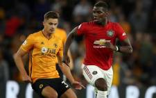 Manchester United's Paul Pogba (right) is chased down by a Wolverhampton Wanderers player during their English Premier League match on 19 August 2019. Picture: @ManUtd/Twitter