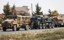 FILE: Turkish forces are seen in a convoy on a main highway between Damascus and Aleppo, near the town of Saraqib in Syria's northern Idlib province, on 29 August 2018. Picture: AFP.