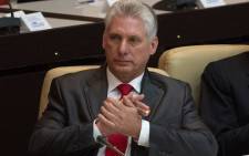 FILE: Cuba's new president Miguel Diaz-Canel, applauds during the speech of Cuban former president Raul Castro (out of frame) after he was formally named president by the National Assembly, in Havana on 19 April 2018. Picture: AFP