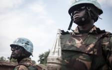 FILE: Tanzanian soldiers from the UN peacekeeping mission in the Central African Republic (MINUSCA), patrol the town of Gamboula, threatened by the Siriri group, on July 6, 2018.  Picture: Florent Vergnes / AFP
