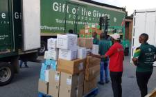 Gift of the Givers volunteers pack boxes of masks, gloves, gowns & disinfectants into trucks. The supplies will be taken to health facilities assisting patients and staff on the front lines of the fight against the spread of the coronavirus. Picture: @GiftoftheGivers/Twitter